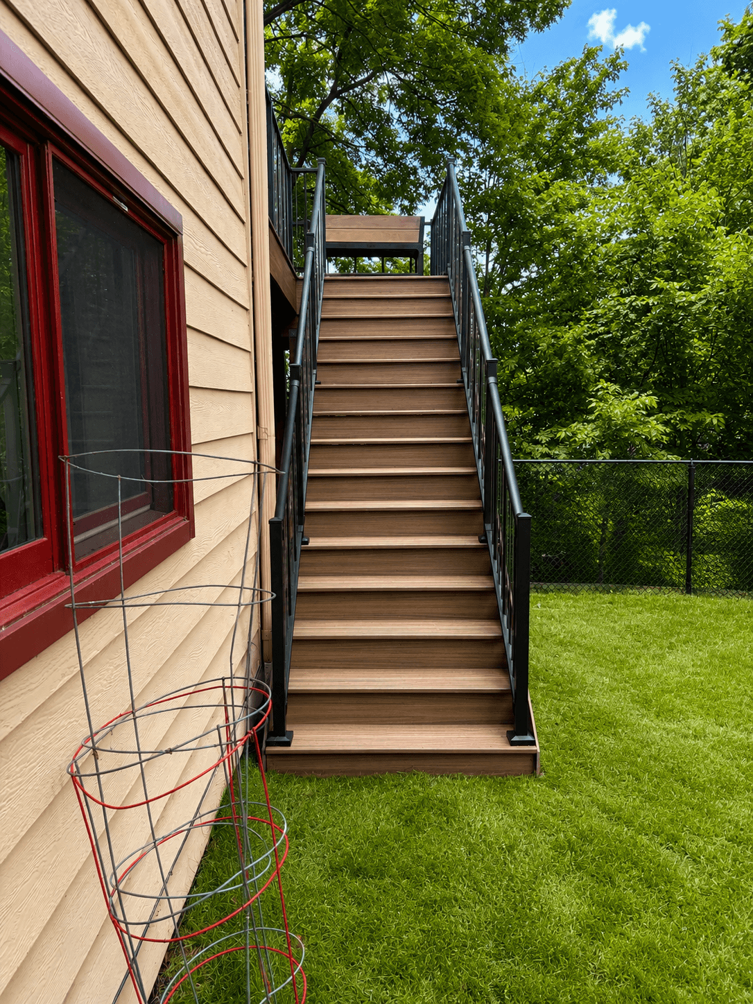 Composite deck stairs with black railings on Bloomington project