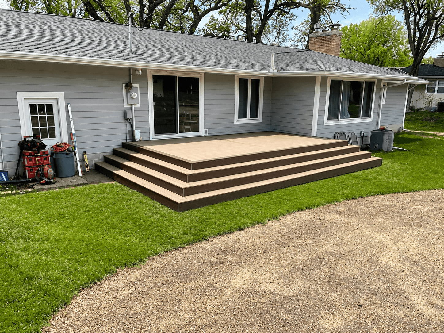 Trex composite deck project with brown picture frame trim